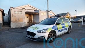 Two men charged with arson over attack on mosque remanded in custody