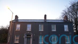 Two men charged over fire at asylum seeker accommodation centre