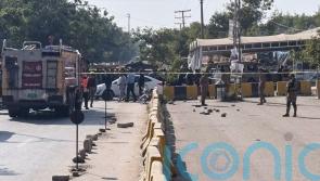 Suicide bomber kills 12 outside court in Pakistan