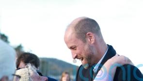 William hugged by well-wisher as he meets young marine conservationists