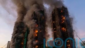 13 dead as fire rages through Hong Kong high-rise residential complex