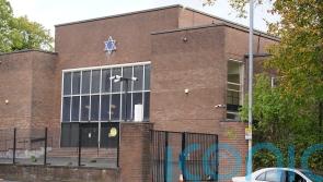 Man arrested in connection with synagogue attack after arriving on flight