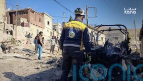 Israeli forces kill at least 13 people in southern Syria raid, officials and residents say