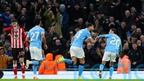 Man City close gap on leaders Arsenal with one-sided win over Sunderland