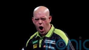 Michael van Gerwen survives scare to reach World Championship second round