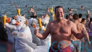 In Pictures: Cold water courage to start the new year as swimmers dive into 2026