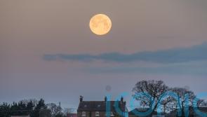 Wolf supermoon appears in clear UK skies