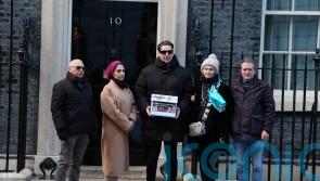 Family of UK couple detained in Iran and supporters hand petition to No 10