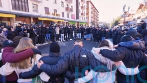 Hundreds march in silence to honour victims of Swiss bar fire