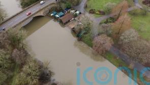 Ice warning after heavy rain and melting snow causes flood disruption