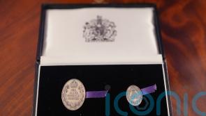 Family of 21-year-old paramedic who died in ambulance crash honoured by the King