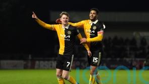 Burton stun Huddersfield to climb out of relegation zone