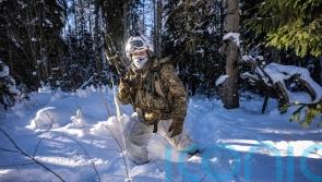 Soldiers wade through &lsquo;chest-deep&rsquo; snow during training close to Russian border
