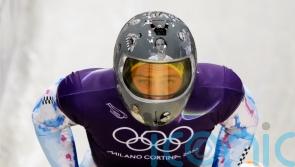 IOC urges Ukrainian racer to compete amid row over banned war victim helmet