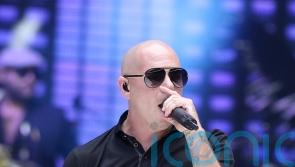 Pitbull to try to break record for largest gathering of people wearing bald cap