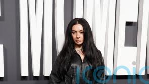 Charli XCX stuns in black leather ensemble at The Moment UK premiere