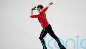 Teen Russian figure skater with controversial coach makes Winter Olympics debut