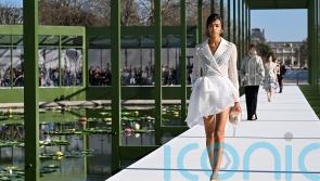 Dior blooms with peplums, bustles and waterlily florals in Paris Fashion Week show