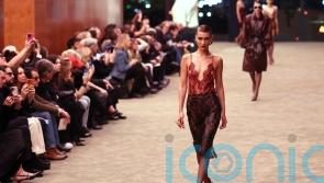 Bella Hadid walks Saint Laurent&rsquo;s tuxedo revival at Paris Fashion Week