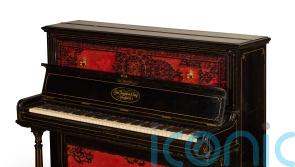 Piano John Lennon used to write Beatles songs fetches record amount at auction