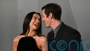 Dua Lipa and Callum Turner lead couples on red carpet at Vanity Fair Oscar Party