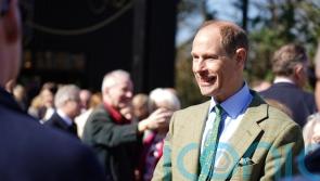 Duke of Edinburgh goes behind the scenes at zoo to prepare gorilla food