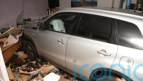 Woman whose ex tried to murder her by crashing into funeral parlour wins payout