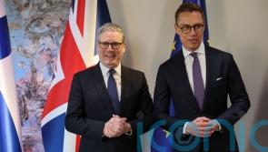 West facing &lsquo;war on two fronts&rsquo;, Starmer warns at defence summit