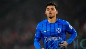 Late Andre Dozzell goal earns 10-man Pompey a draw with relegation rivals Oxford
