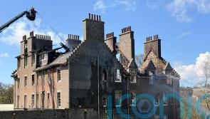 Listed building near hospital wrecked by fire as crews remain at scene