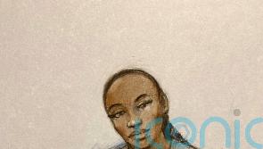 X Factor finalist facing attempted murder charge makes heart sign from dock