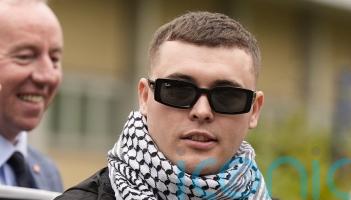 Prosecutors appeal against decision to dump terror case against Kneecap rapper