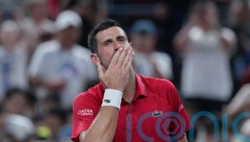Novak Djokovic collapses in Shanghai heat but battles back to reach last eight
