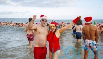 Hundreds brave the cold to make a splash for charity