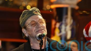Bono joins annual Dublin city centre Christmas Eve busking session