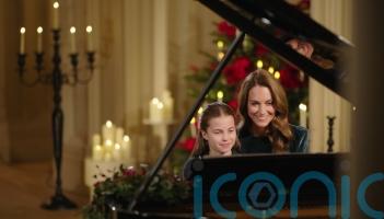 Kate and Charlotte perform together on the piano for royal carol concert