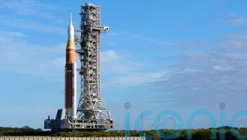 Nasa rolls out rocket for first mission in decades to take crew around moon