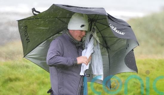 Robert MacIntyre battles brutal conditions to take share of lead on home soil