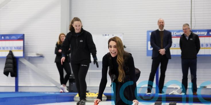 Kate and William try their hand at curling in Stirling