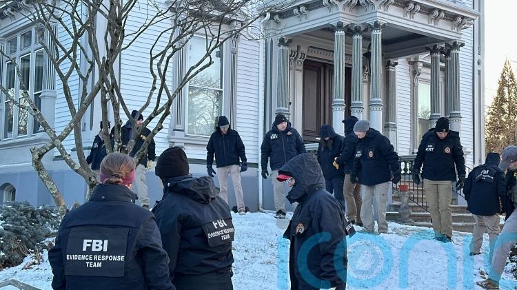 Search for the Brown University gunman resumes after person of interest released