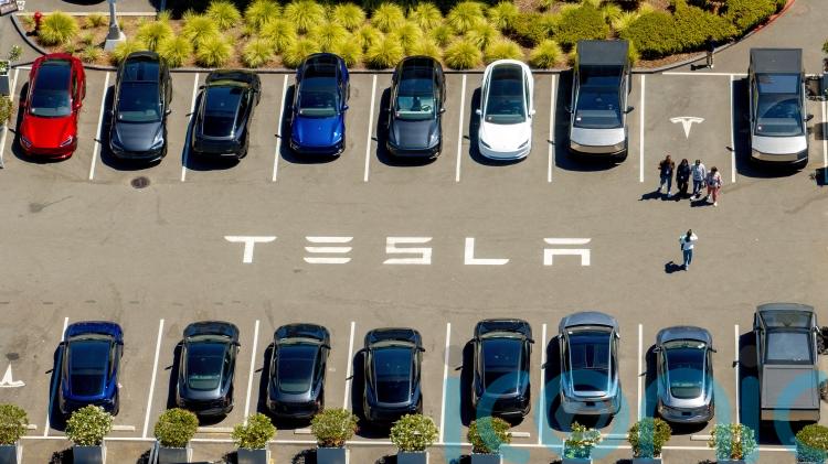 Tesla loses title as world&rsquo;s biggest electric vehicle maker as sales fall again