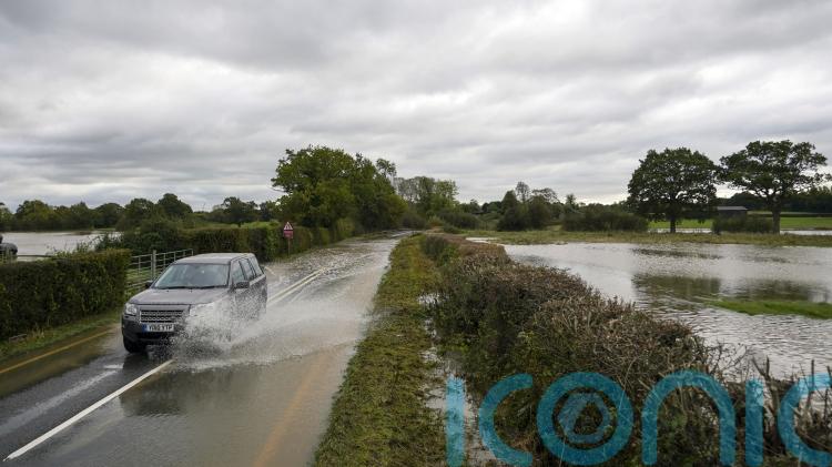 Three people rescued from vehicles as heavy rain causes floods