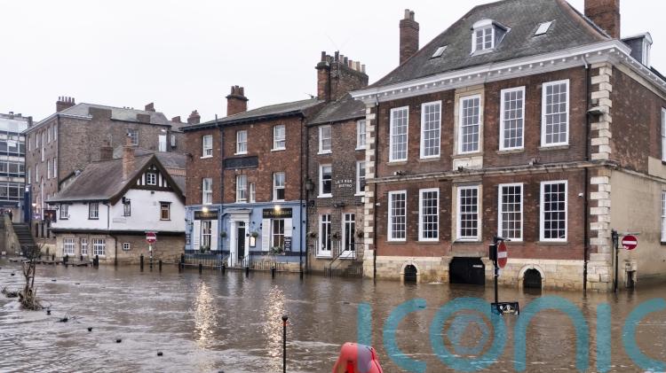 Police search for missing kayaker as heavy rain sparks flood warnings