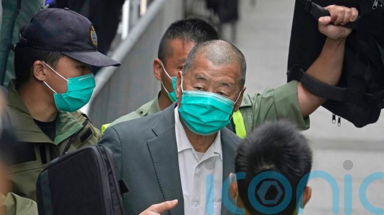 Former media tycoon Jimmy Lai sentenced to 20 years in prison