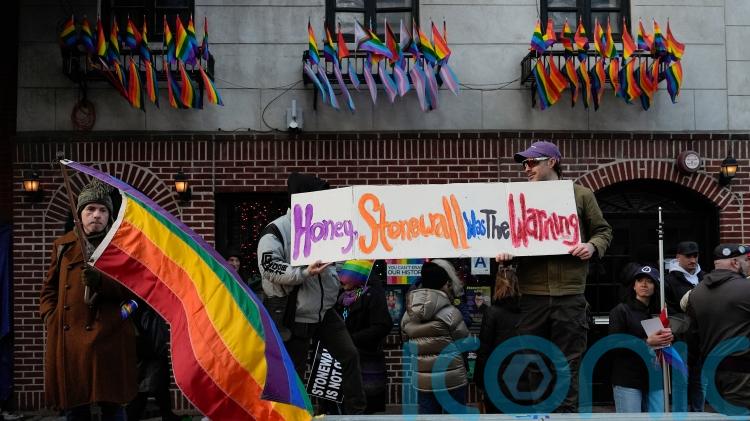 Rainbow flag raised at Stonewall monument in New York in defiance of Trump