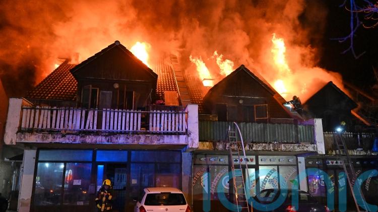 At least three dead and dozens hurt after blaze at apartments near Budapest