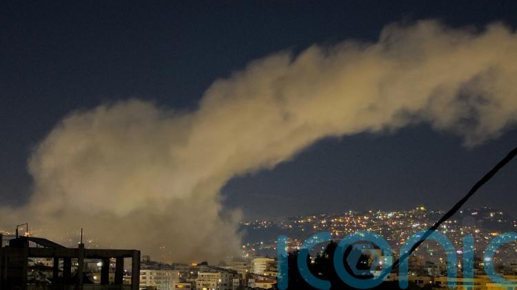 Israel launches strikes on Beirut after Hezbollah fires missiles across border