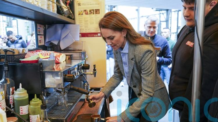Kate makes cappuccino for William during Borough Market visit