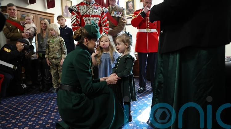 Kate delights little girl as she celebrates St Patrick&rsquo;s Day with Irish Guards