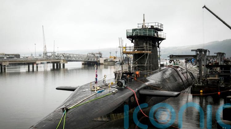 Iranian man and Romanian woman charged after submarine base incident